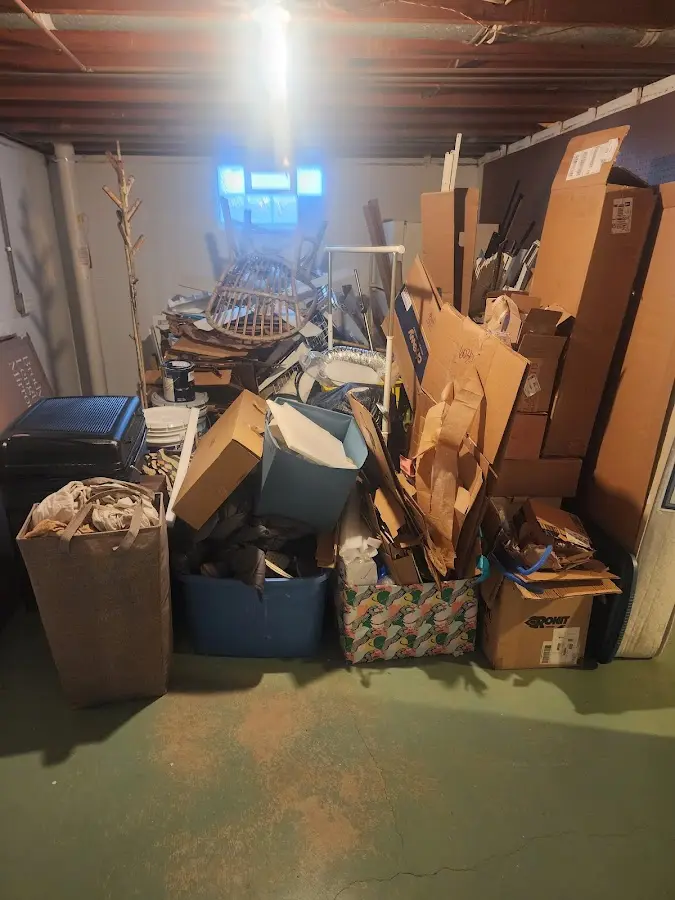 Roll-off dumpster container at job site for 2 Yard Dumpster Rental in Taylor